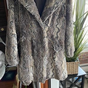 Woman's full length faux fur coat